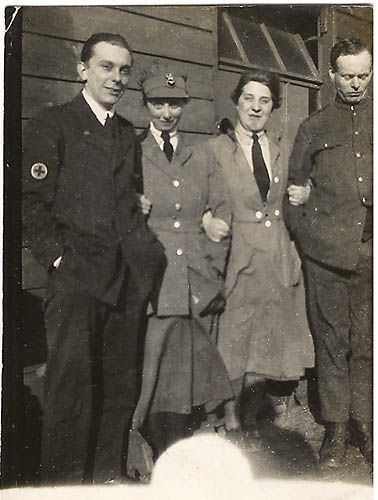 Group of 2 men and 2 women in various uniforms